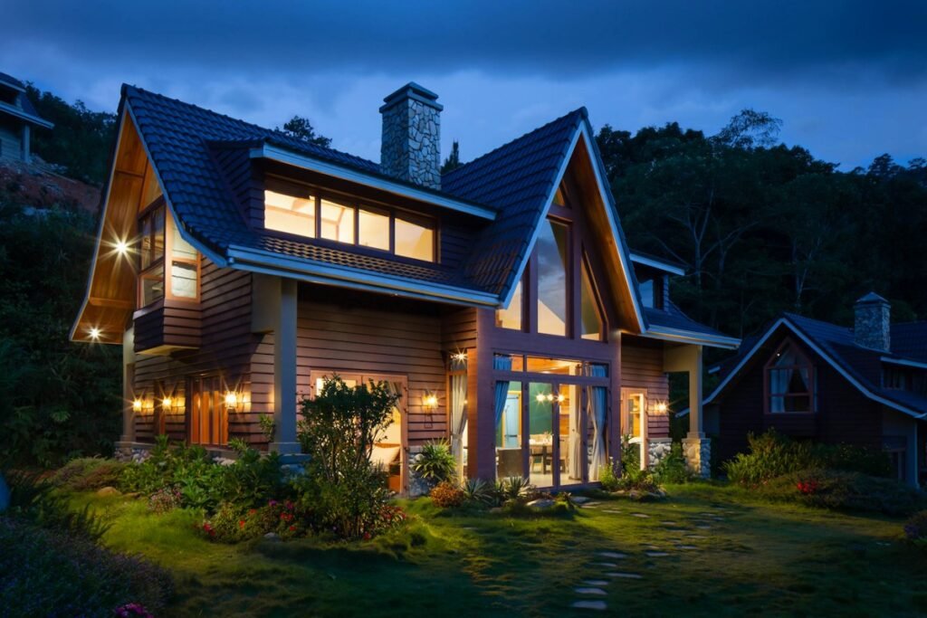 Two-storey home lit up at dusk