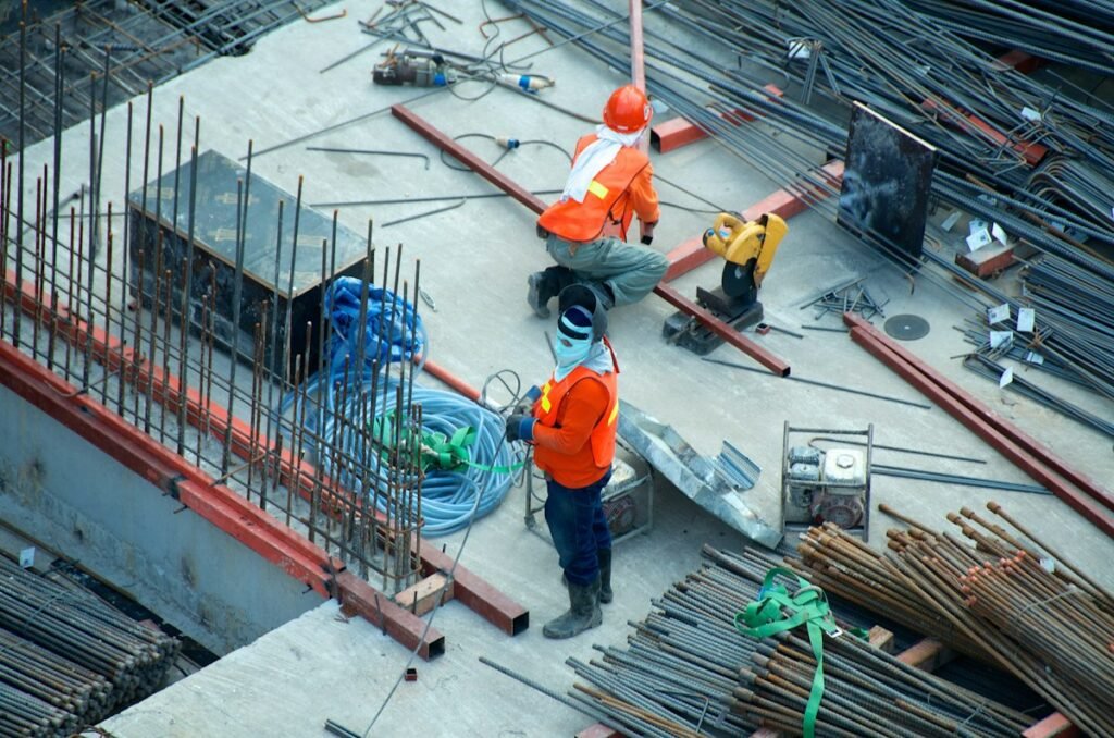 Tradesperson in safety gear working on a construction site